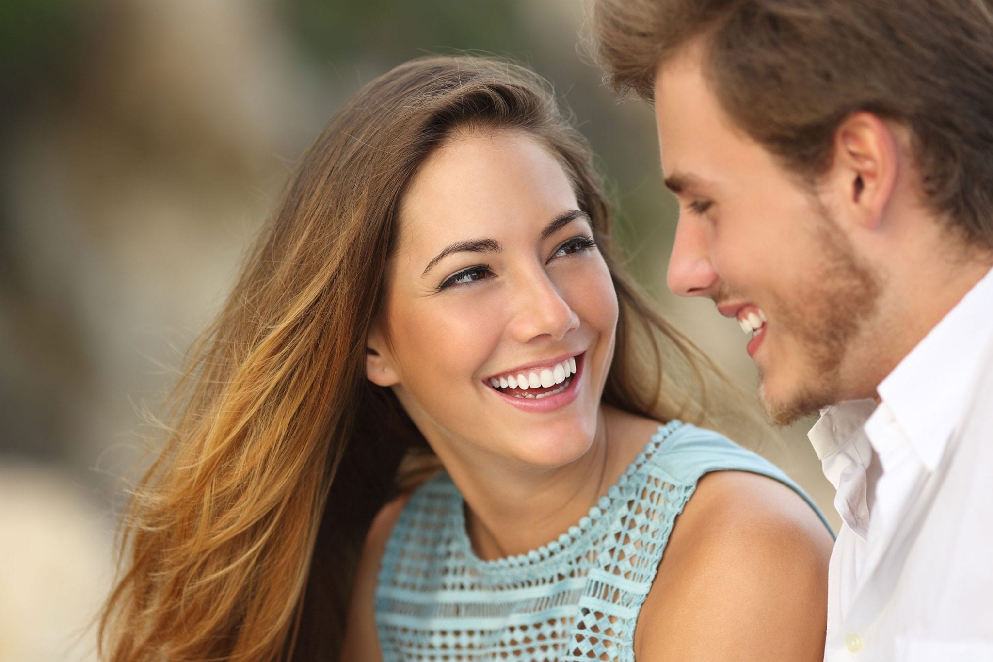couple smiling FAQ’s About Dental Care During Pregnancy Aqua Springs Dental San Marcos, TX Dr. Alexandra Aponte